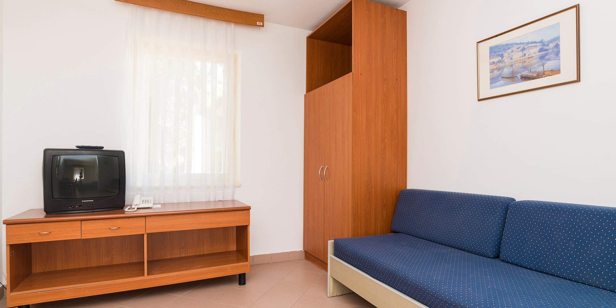 a room with a couch and a tv