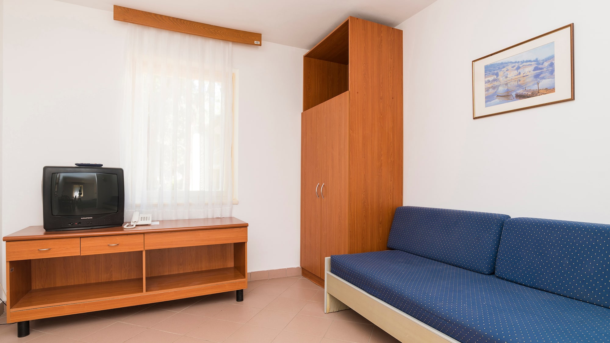 a room with a couch and a tv