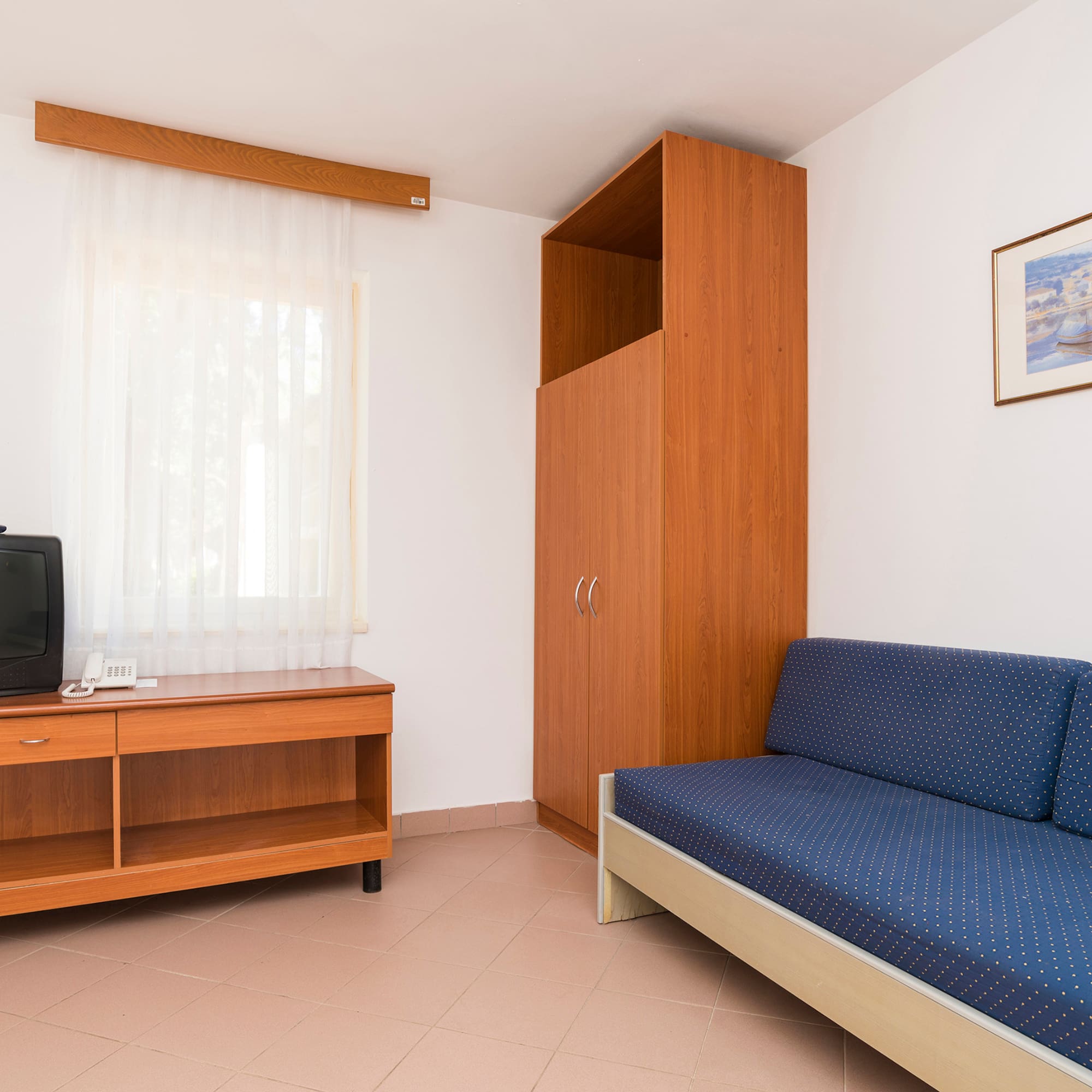 a room with a couch and a tv