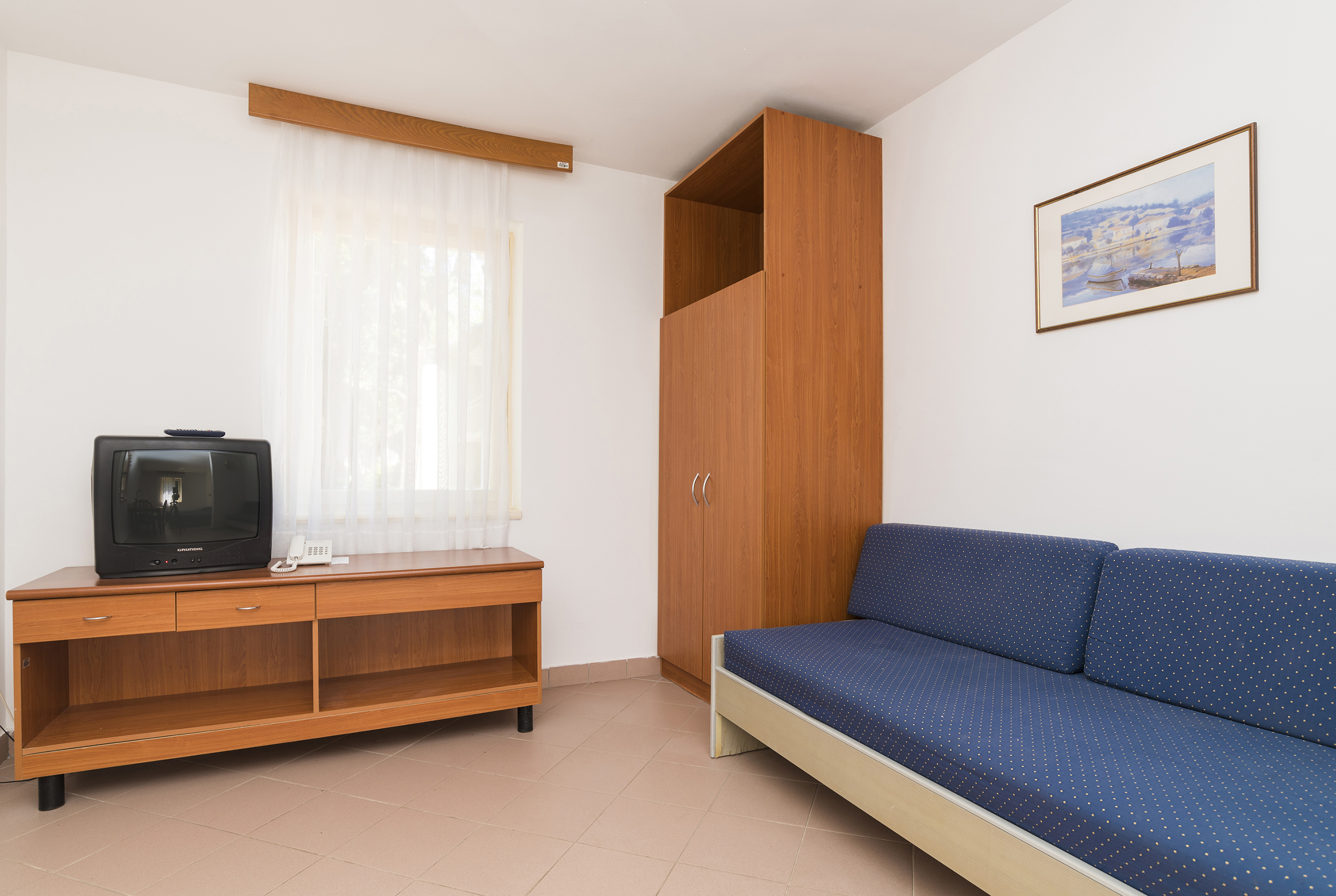 a room with a couch and a tv