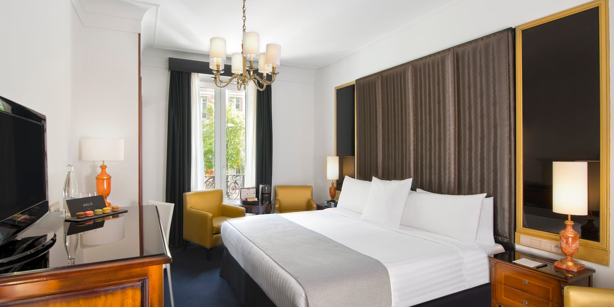 a room with a bed and a desk