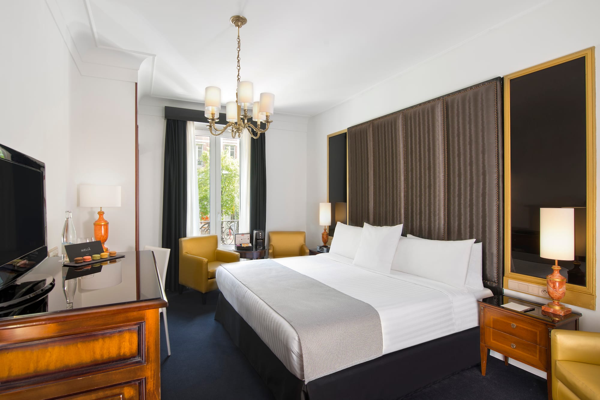 a room with a bed and a desk