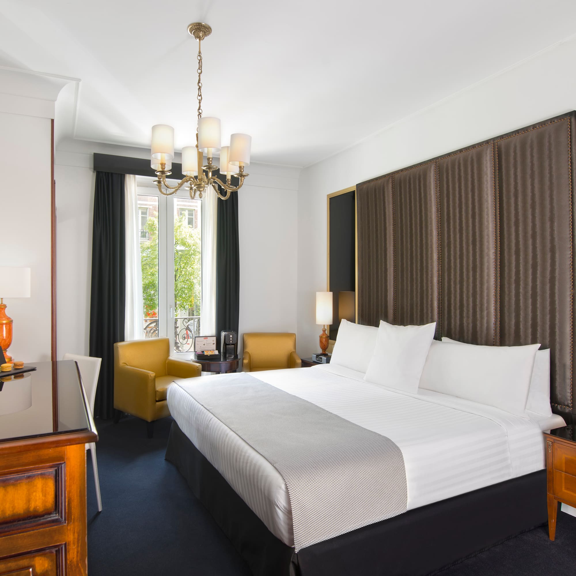 a room with a bed and a desk