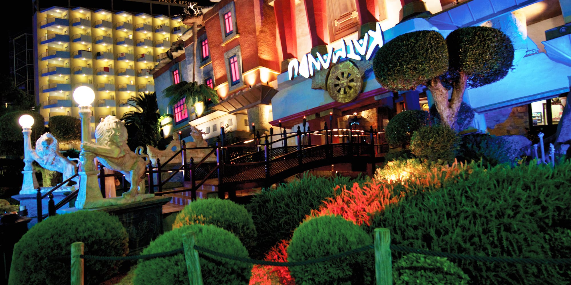 a building with a garden and bushes