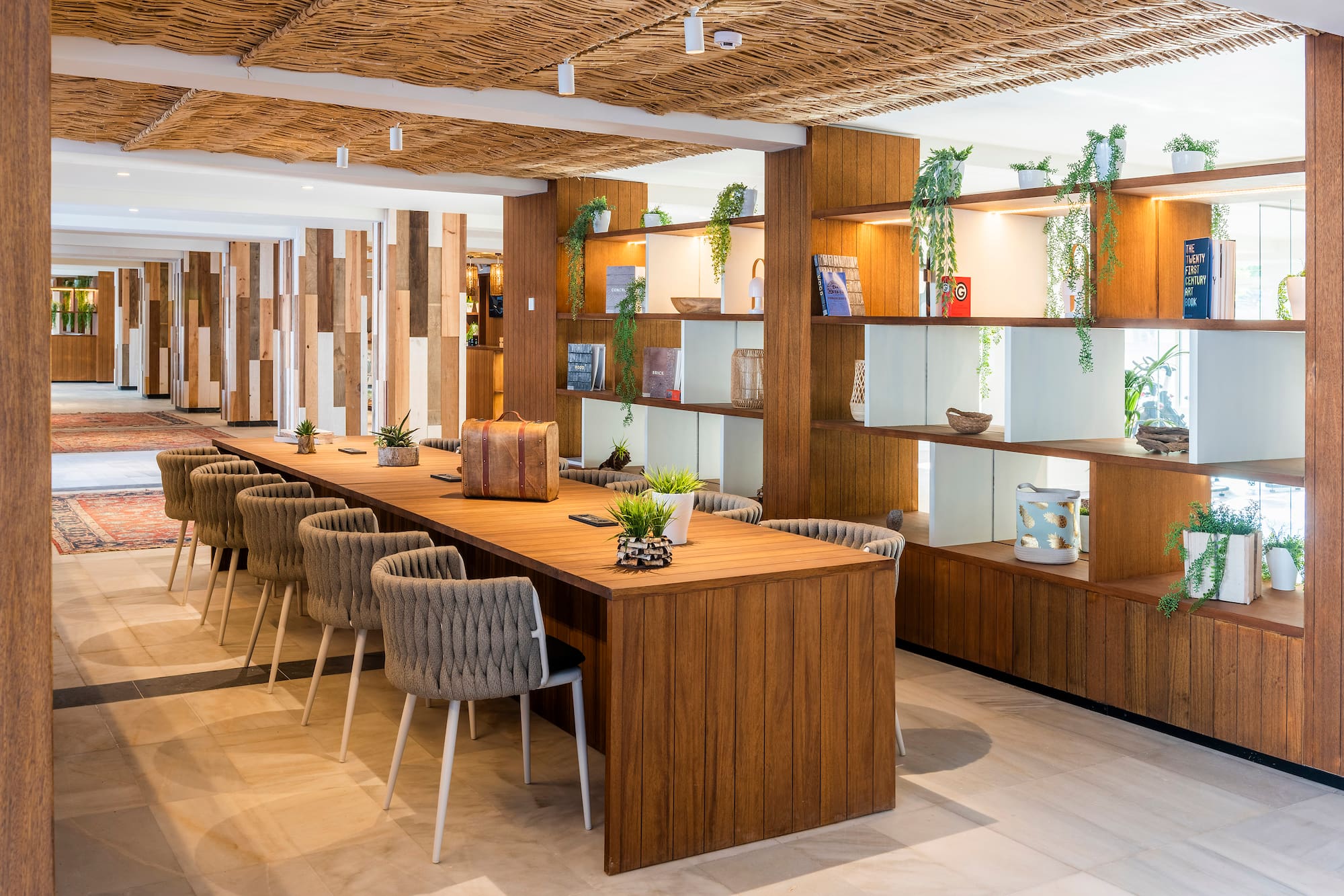 a room with a long table and chairs