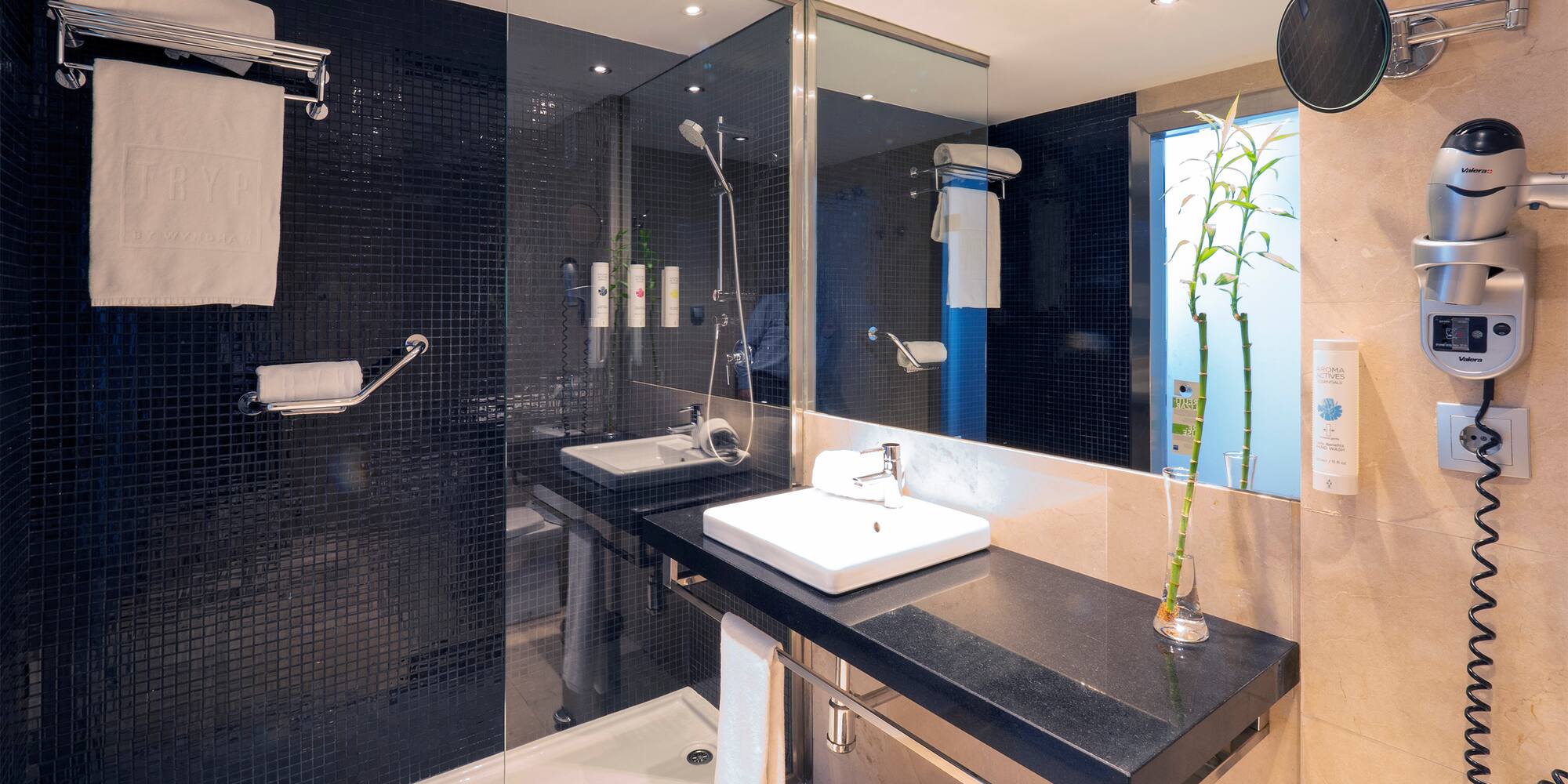 a bathroom with a shower and sink