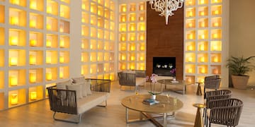 a room with a fireplace and couches