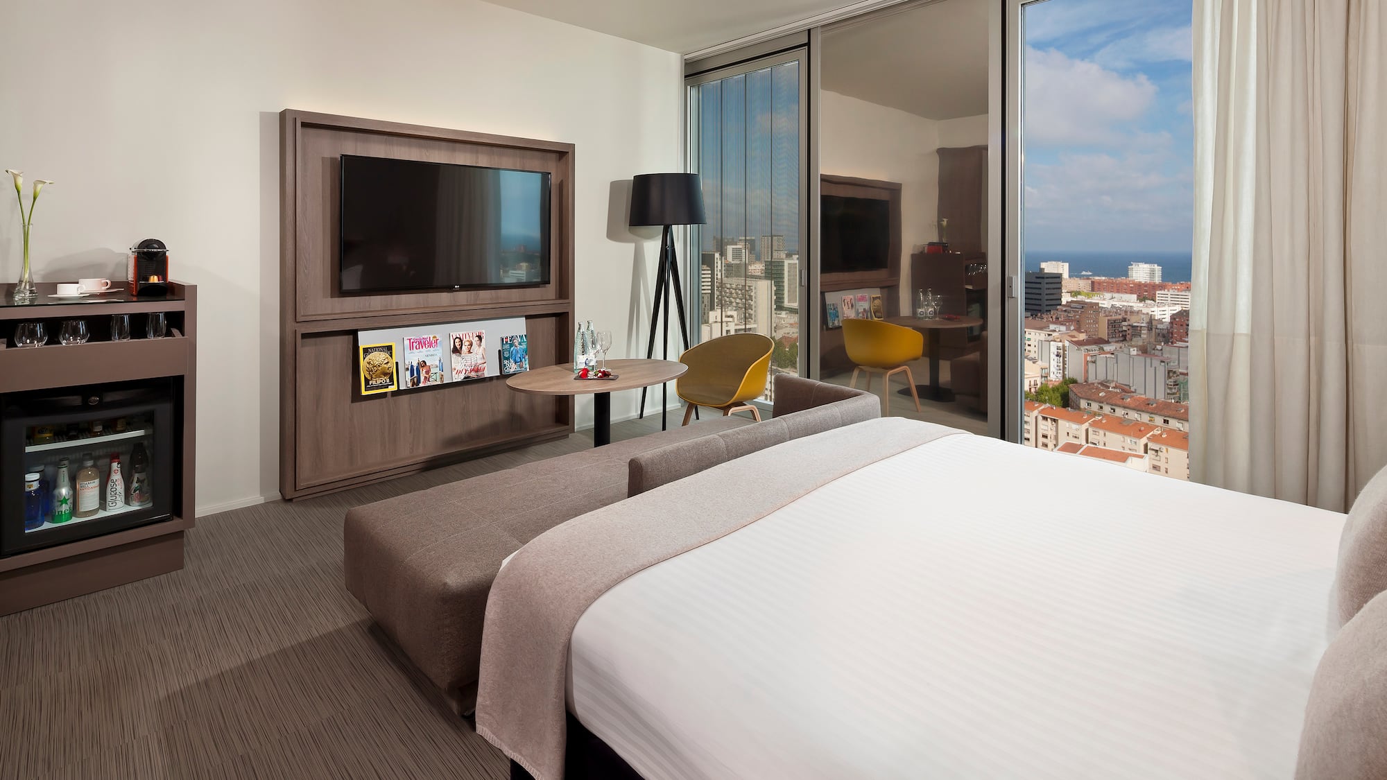 a bedroom with a large television and a large bed