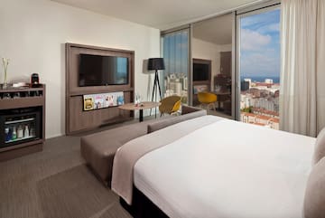 a bedroom with a large television and a large bed