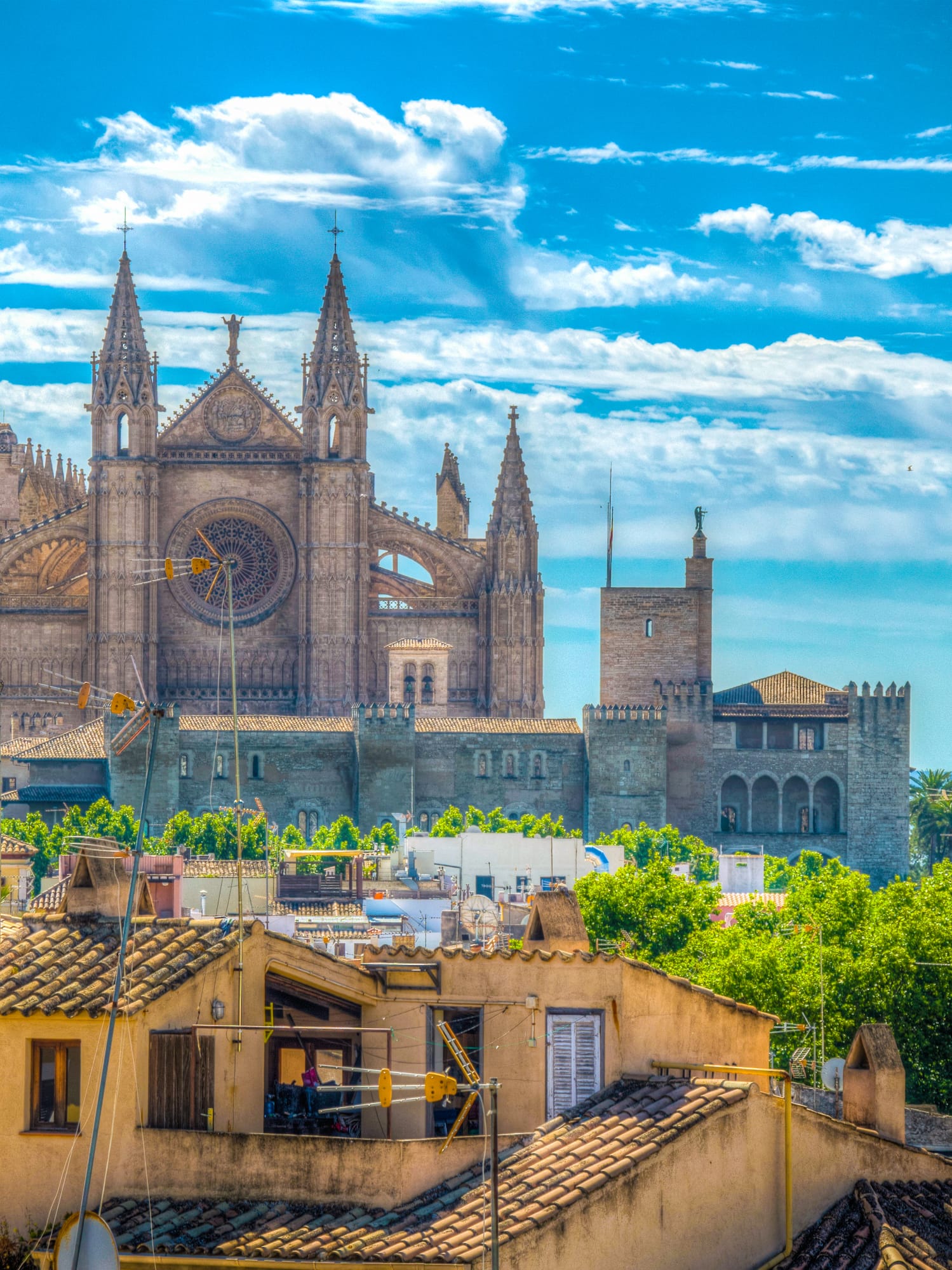 a large stone building with towers and towers on top of a city