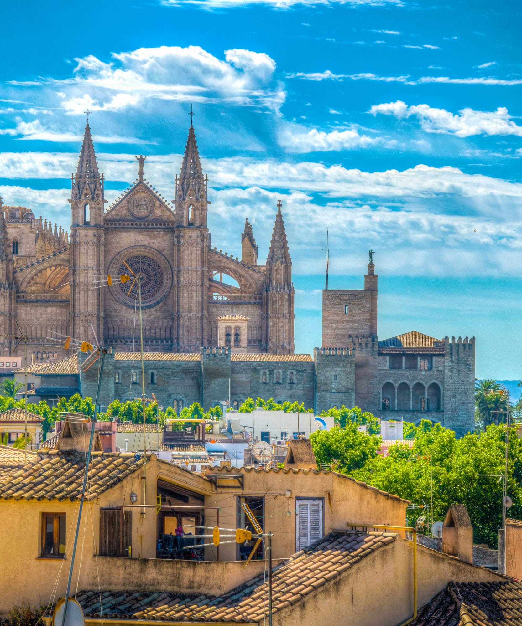 a large stone building with towers and towers on top of a city