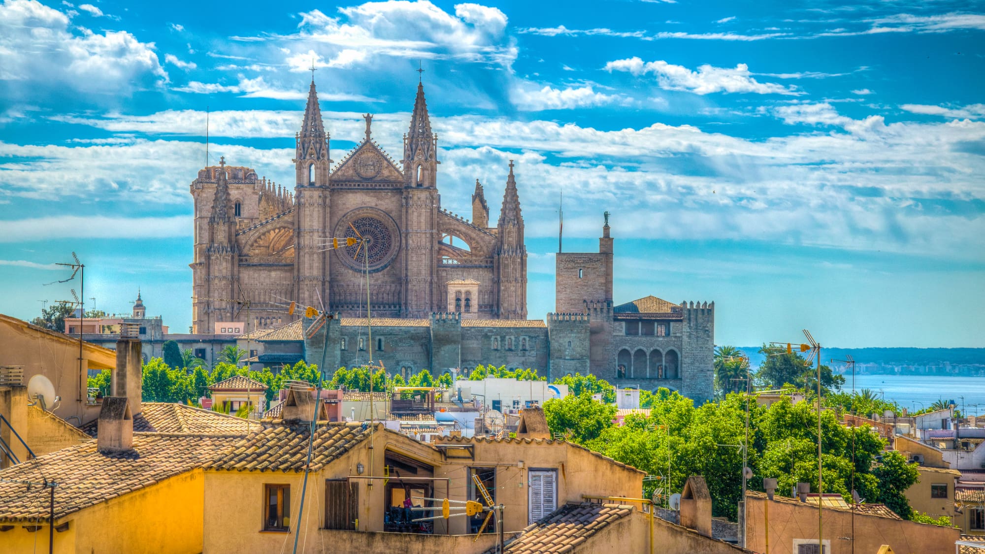 a large stone building with towers and towers on top of a city