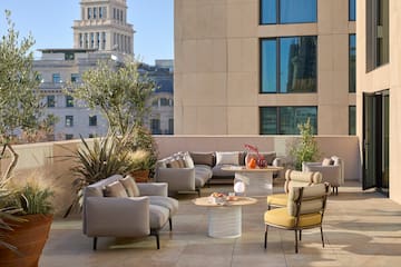 a patio with furniture and a table