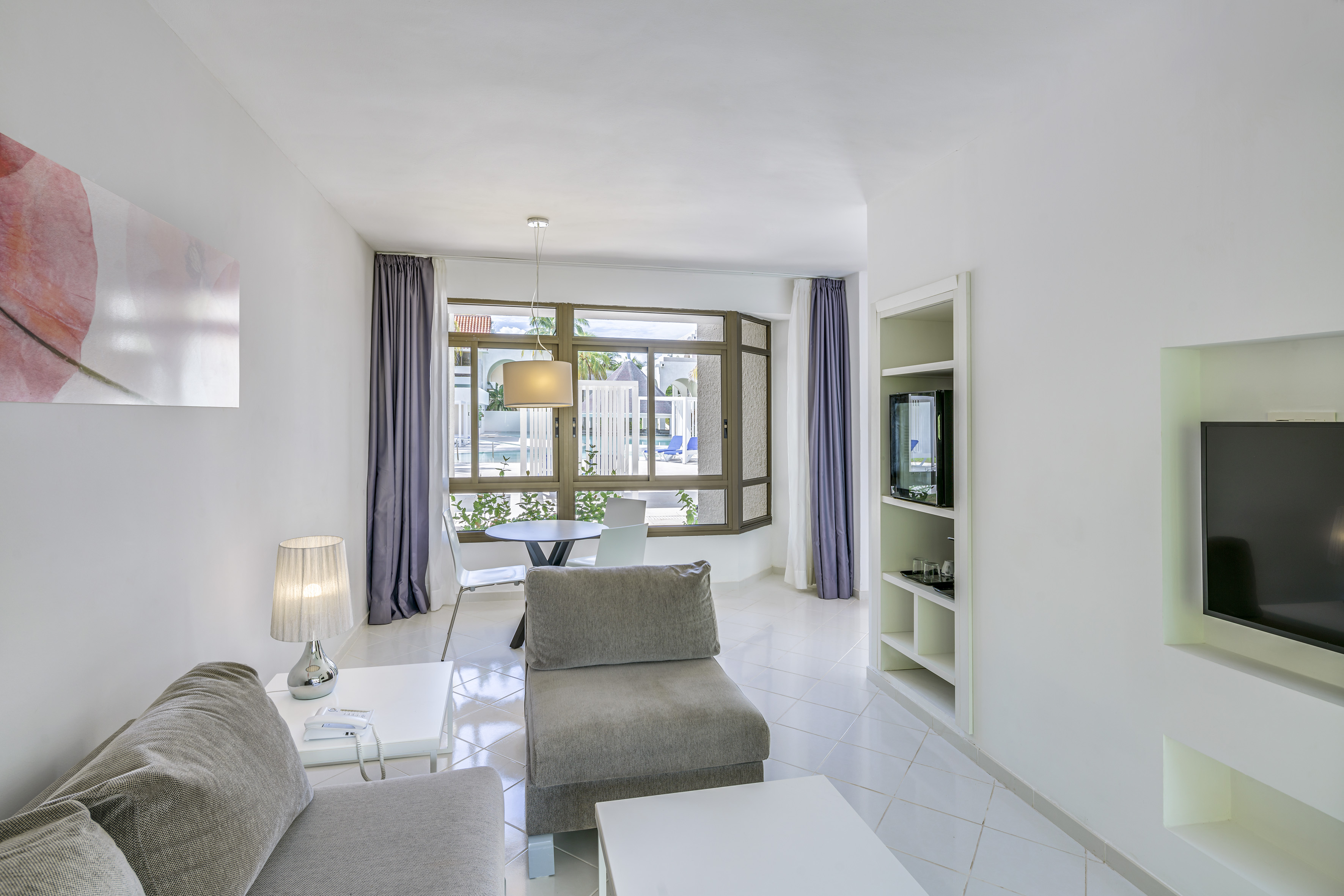 a living room with a couch and a table