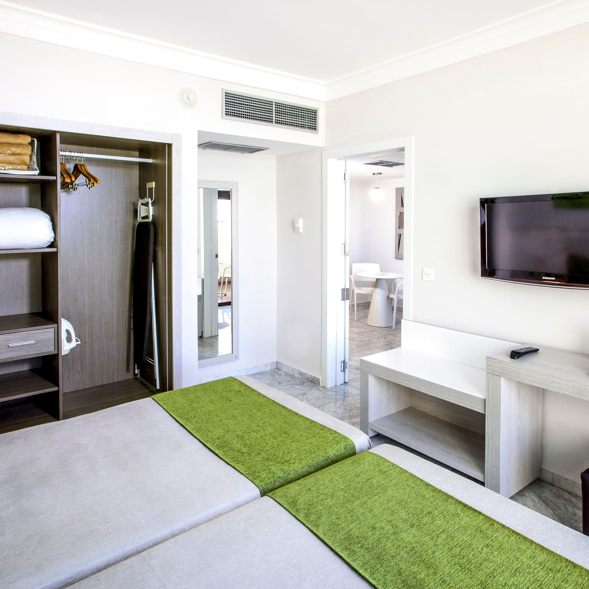 a room with a tv and a bed