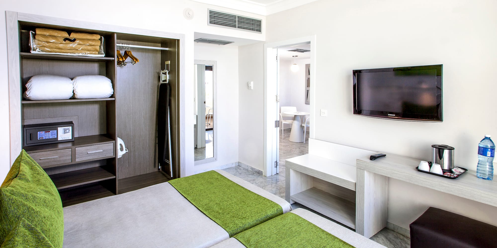 a room with a tv and a bed