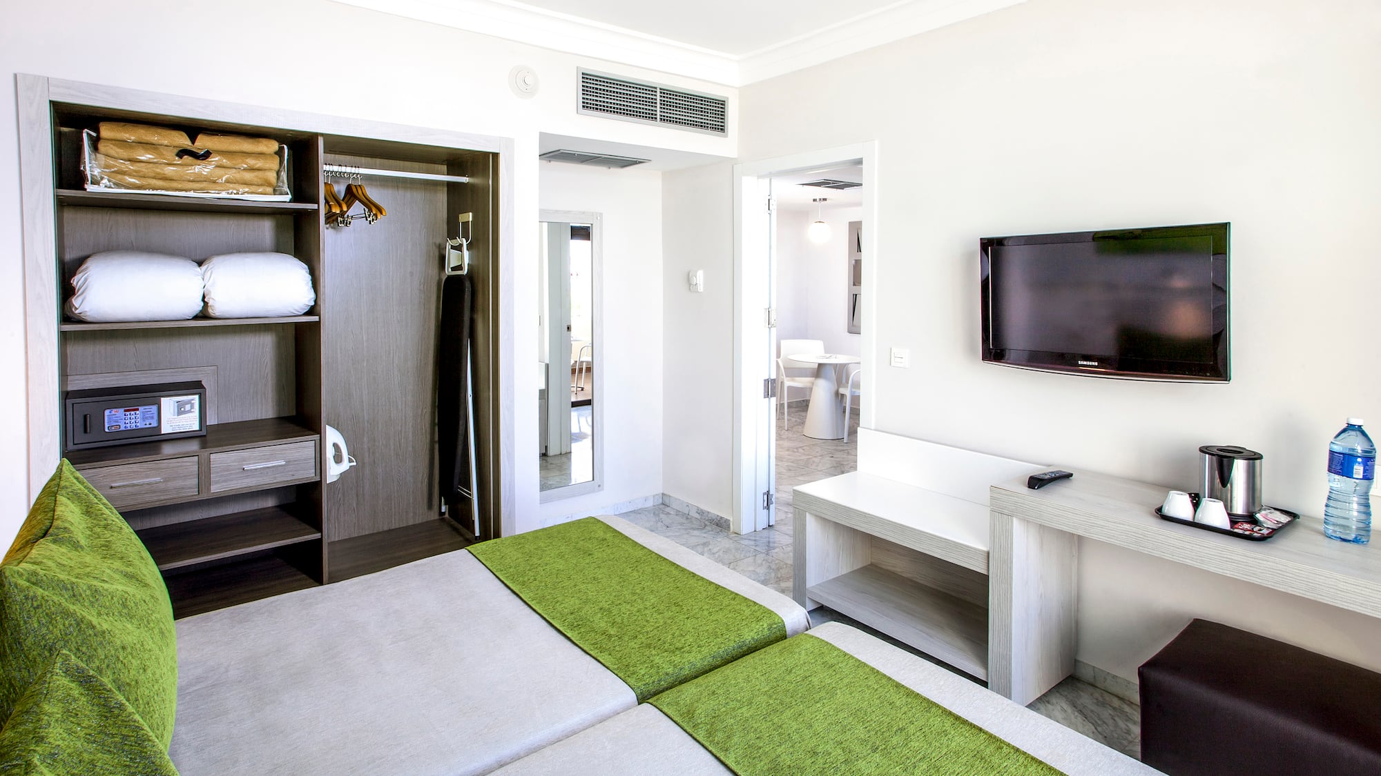 a room with a tv and a bed