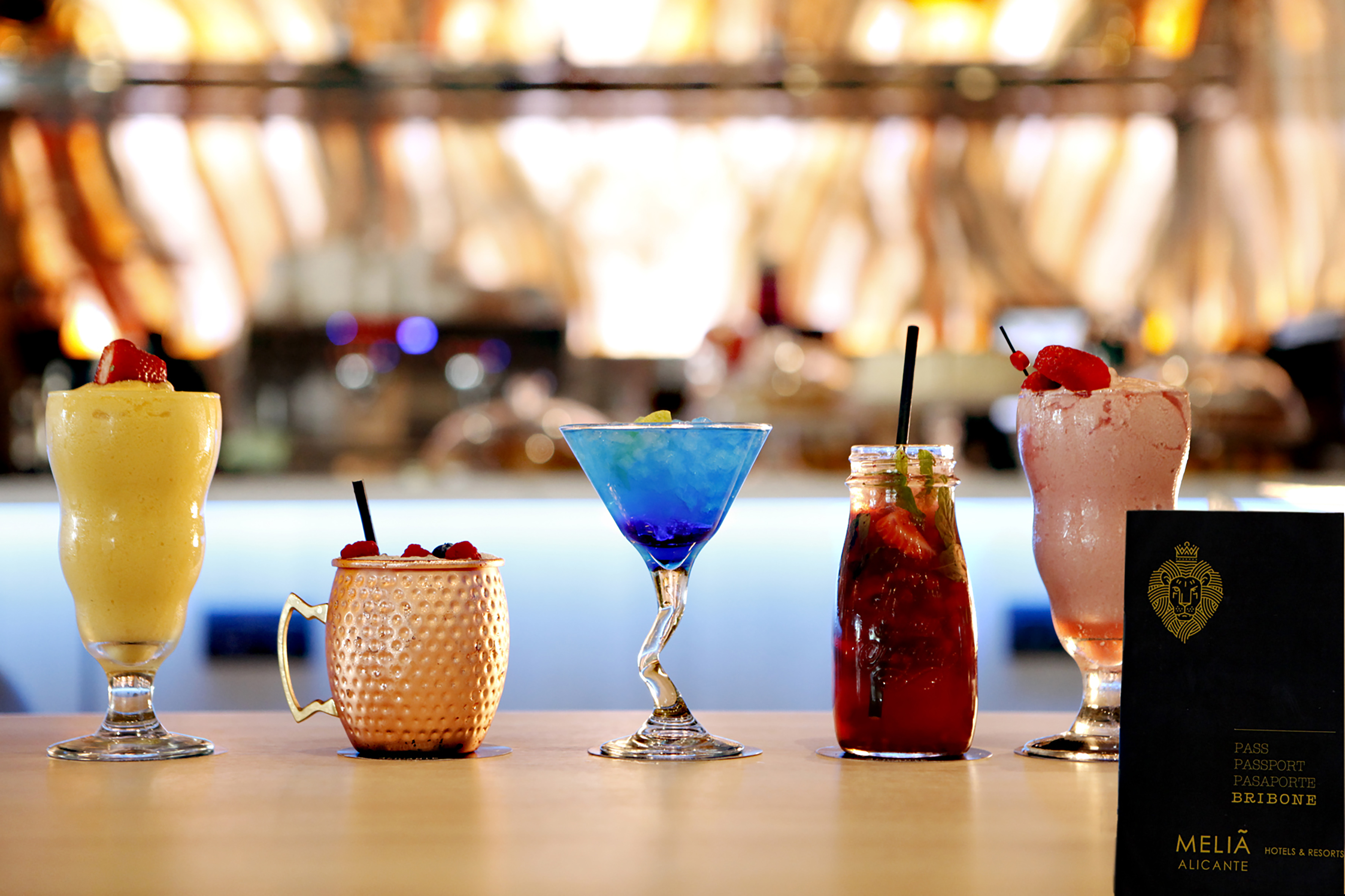 Colorful cocktails, smoothies, and drinks on a Meliã Alicante bar.