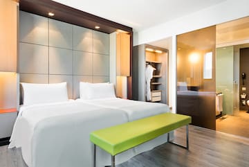 a room with a bed and a bench