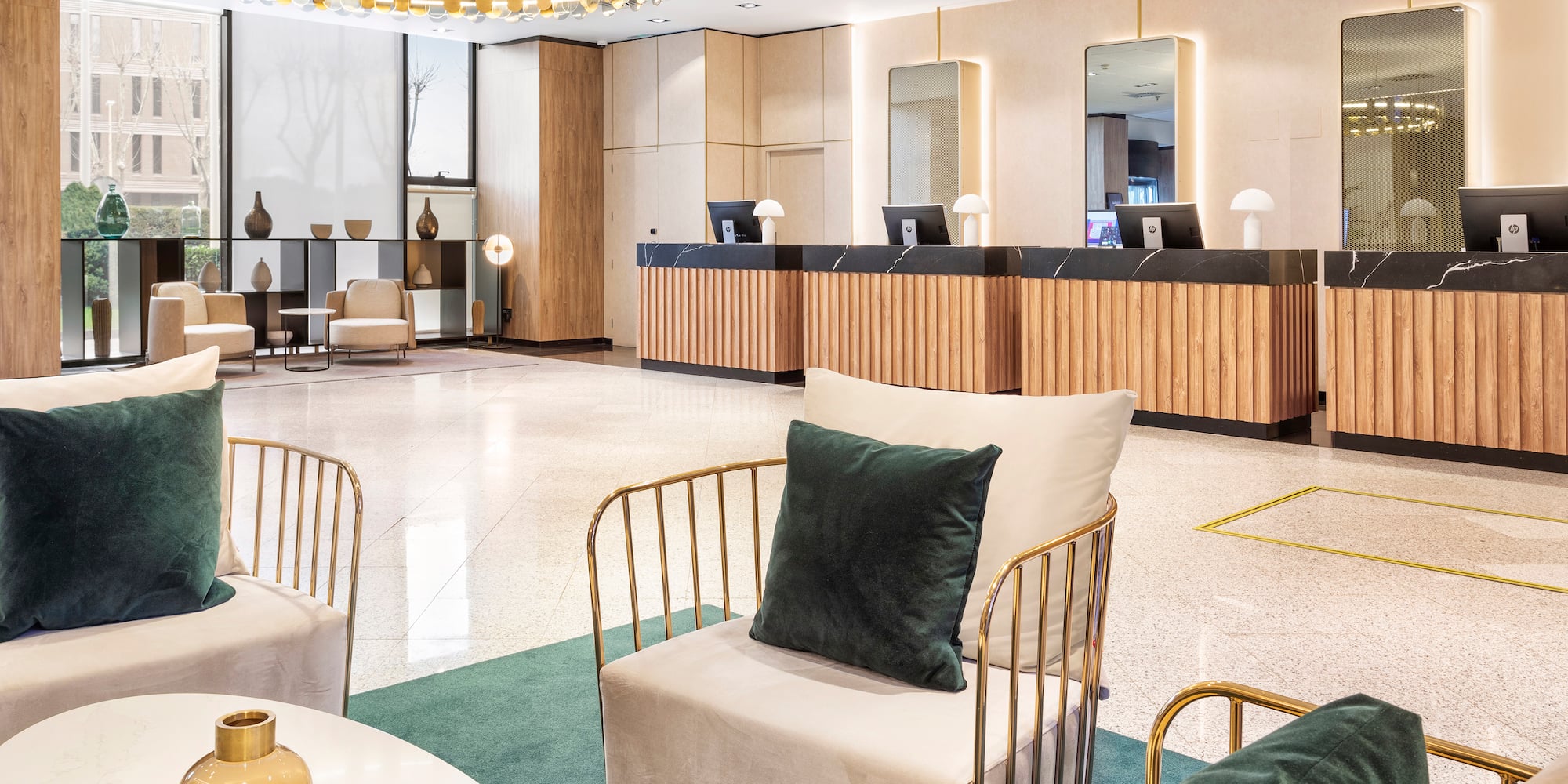 a lobby with a reception desk and chairs