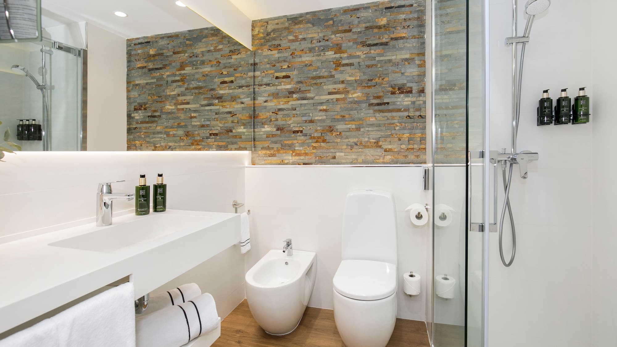 a bathroom with a shower and toilet