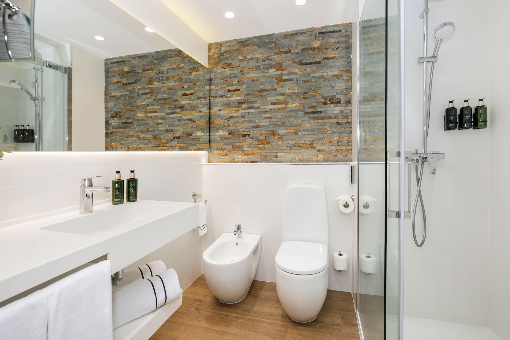 a bathroom with a shower and toilet