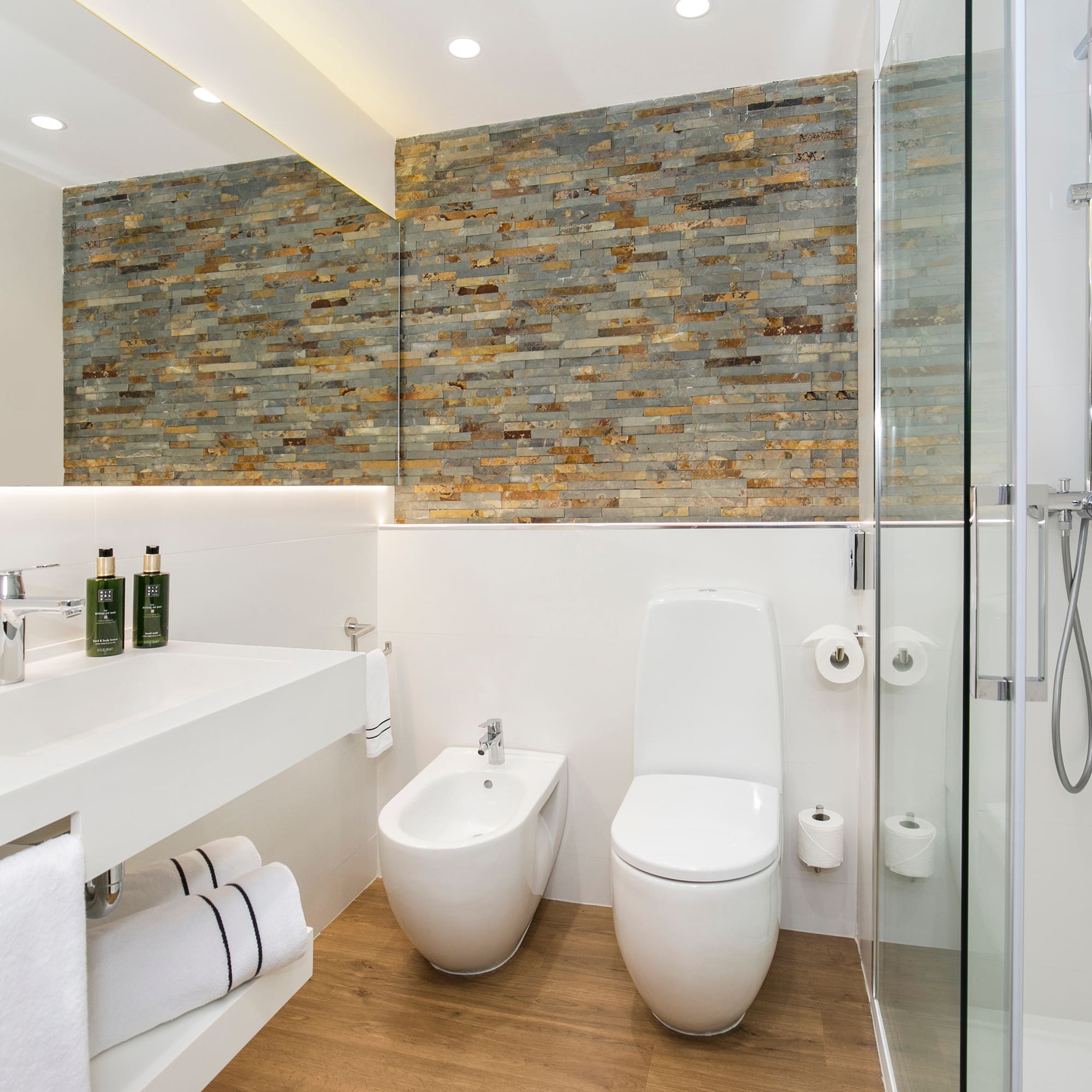 a bathroom with a shower and toilet