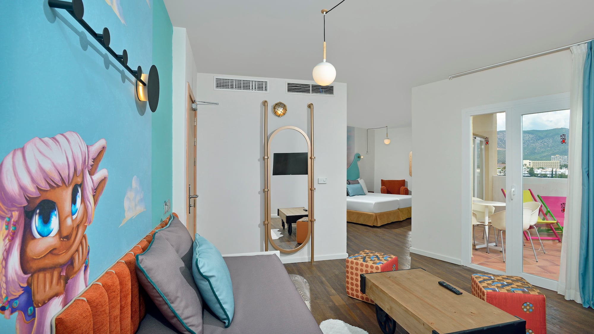 a room with a bed and a mirror