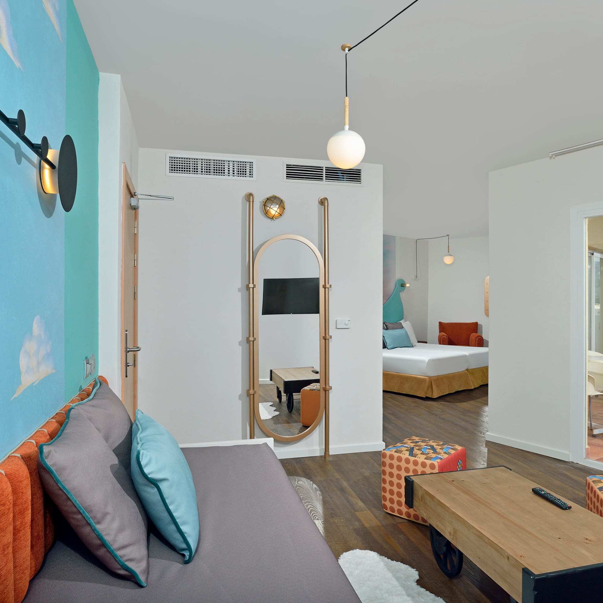 a room with a bed and a mirror