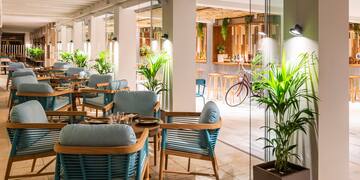 a restaurant with tables and chairs