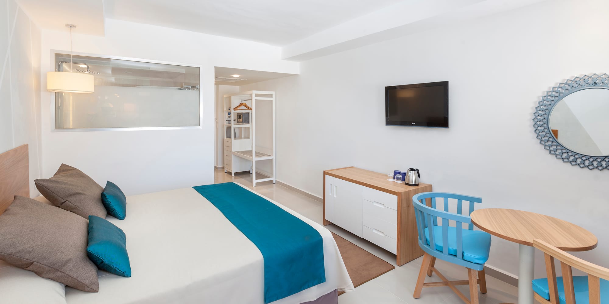 a room with a bed and a tv