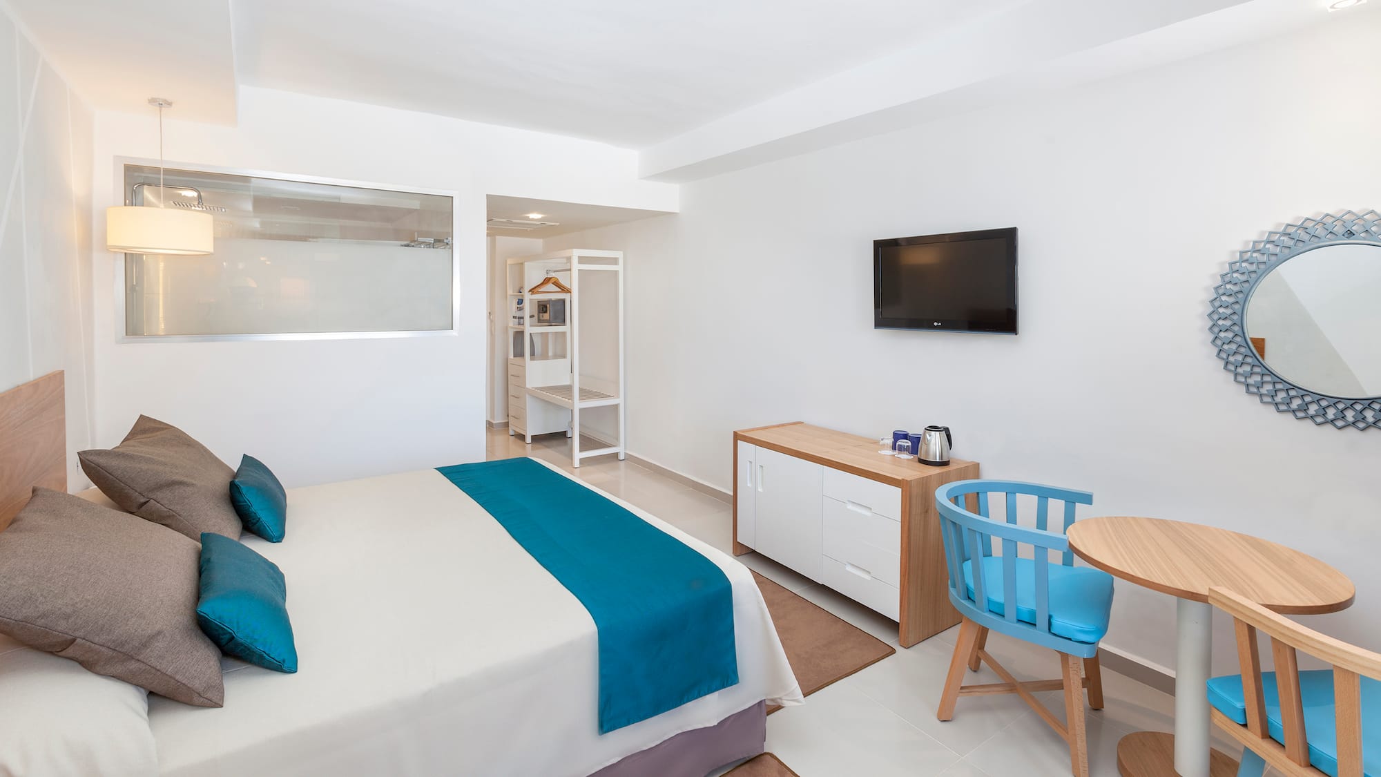 a room with a bed and a tv