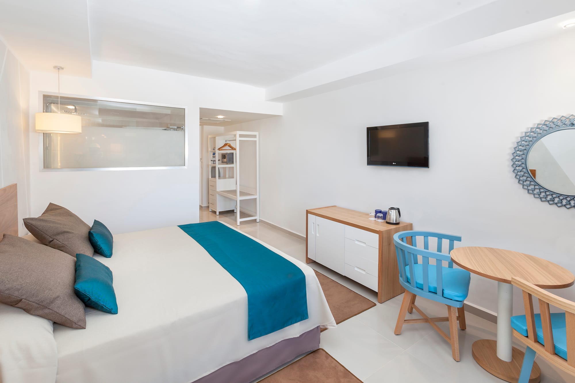 a room with a bed and a tv