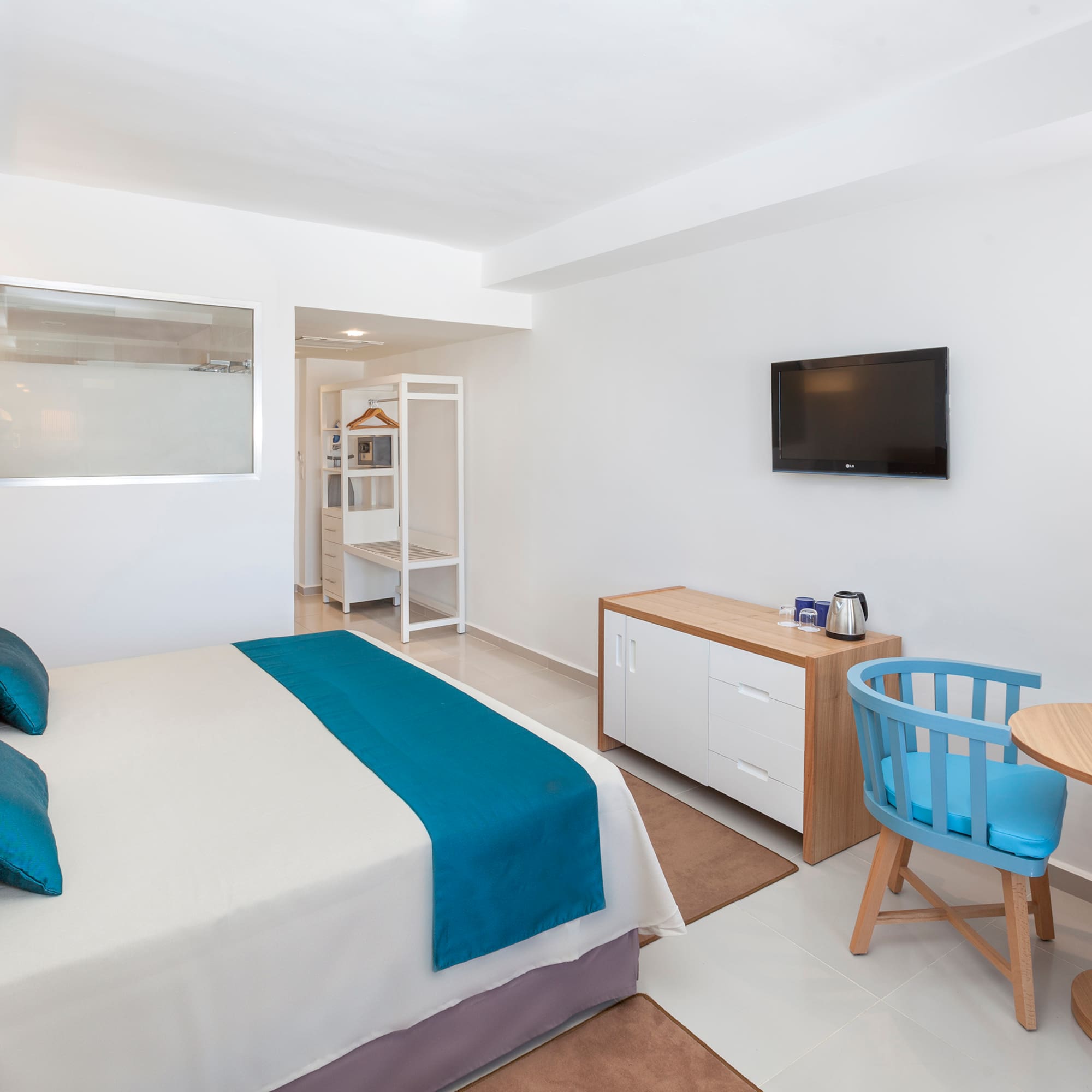 a room with a bed and a tv