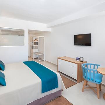 a room with a bed and a tv