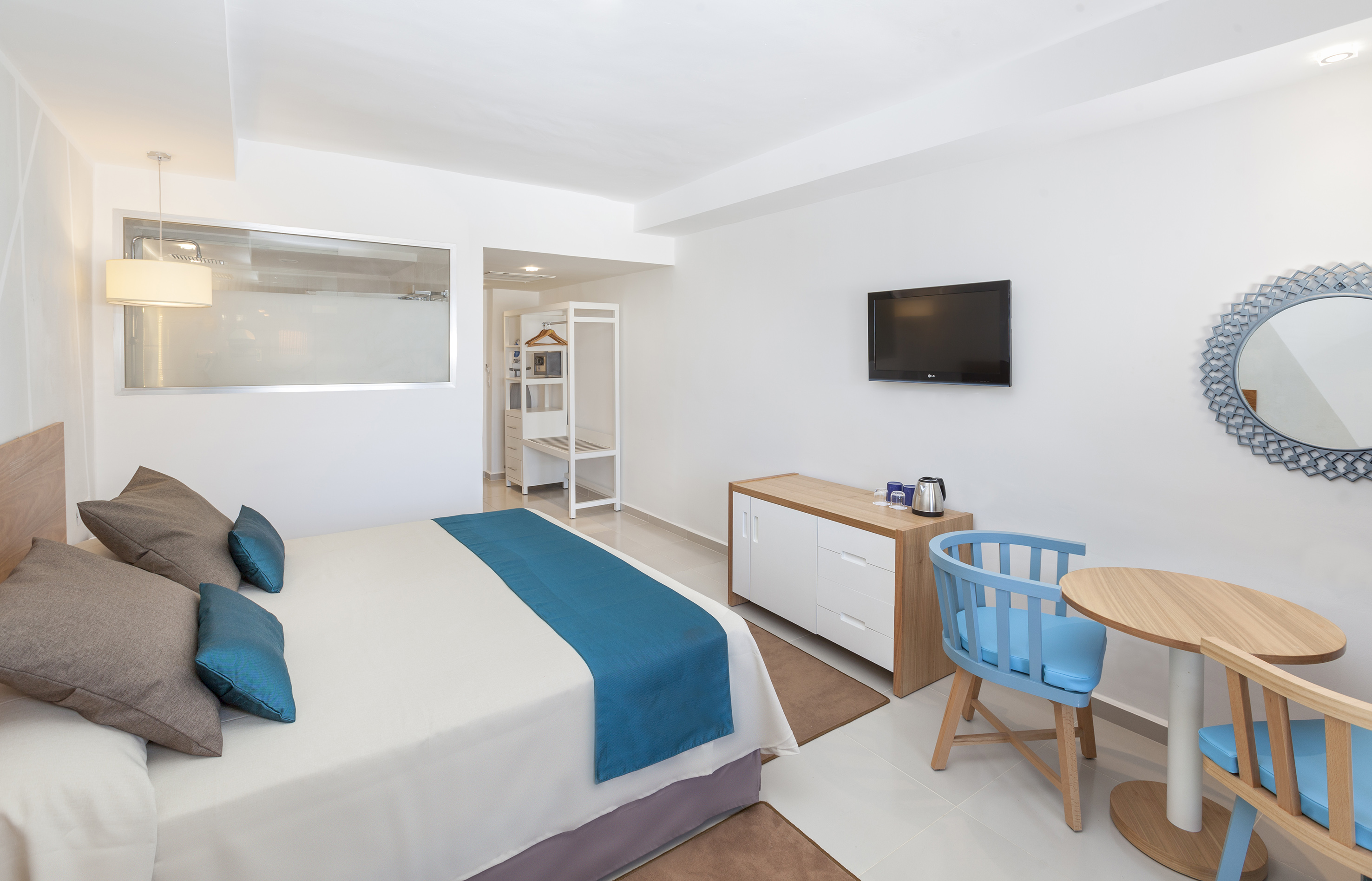 a room with a bed and a tv