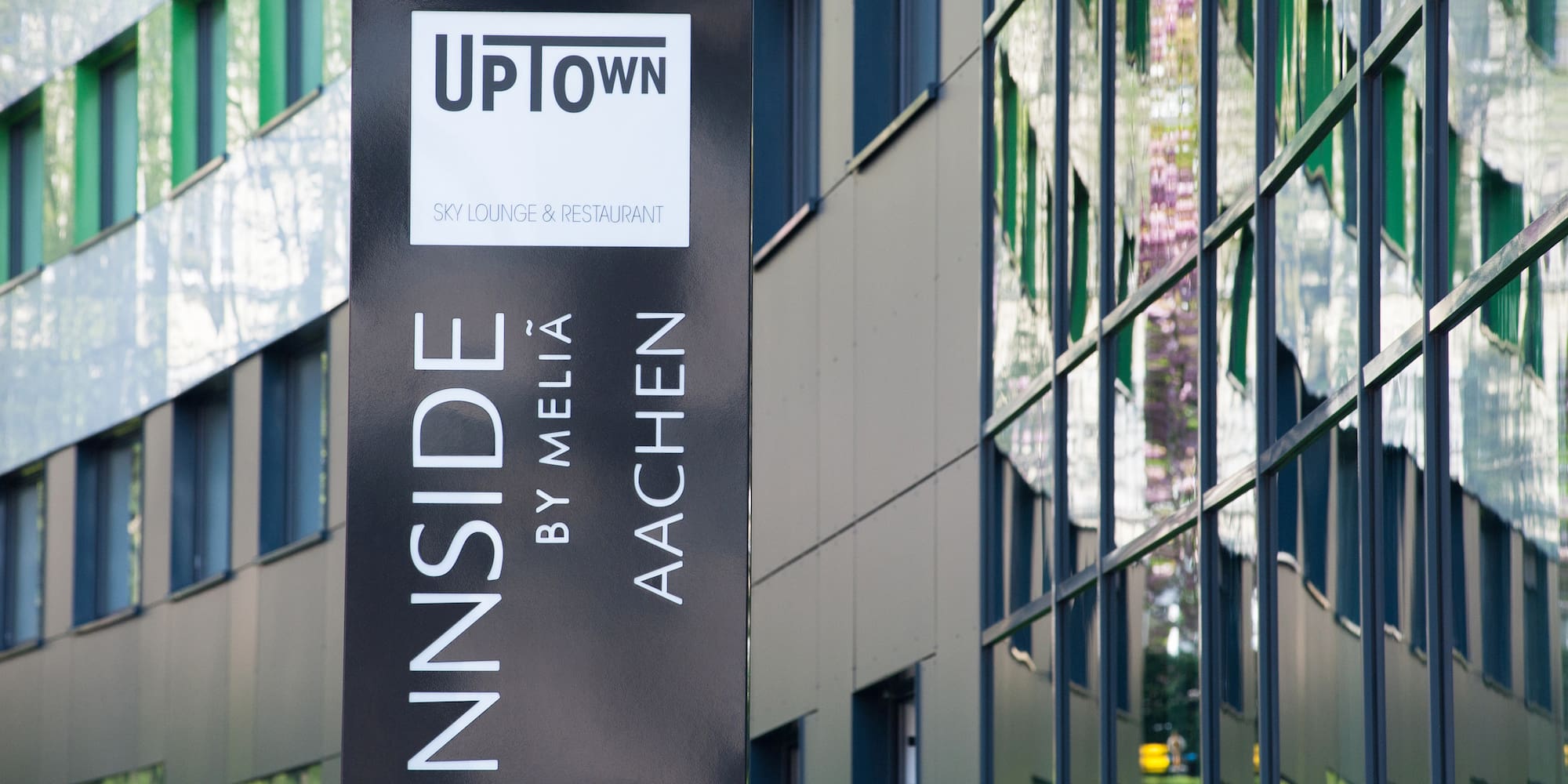 a sign in front of a building