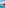 Infinity pool overlooking a turquoise beach and calm bay with boats and green cliffs.