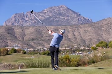 a man swinging a golf club