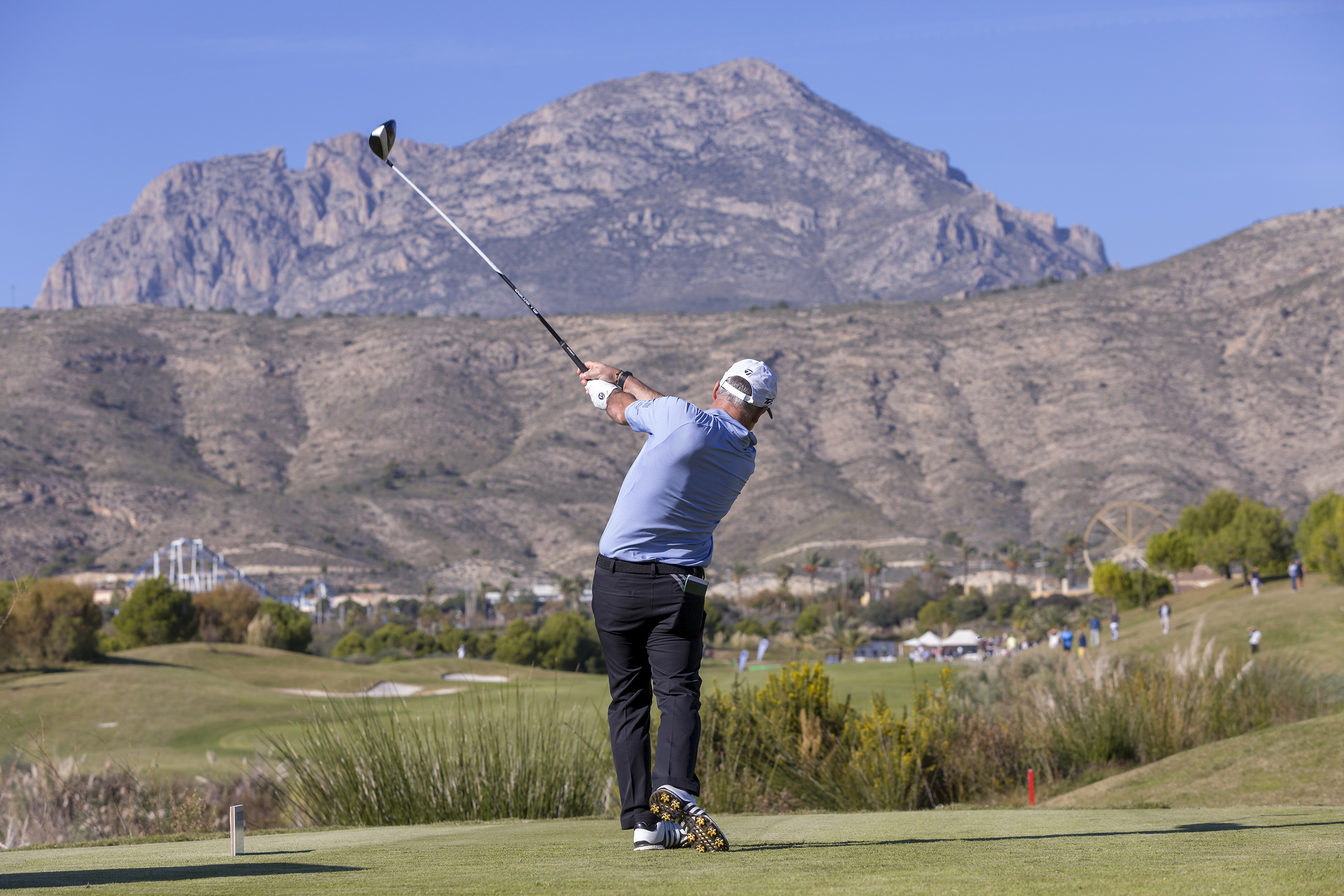 a man swinging a golf club