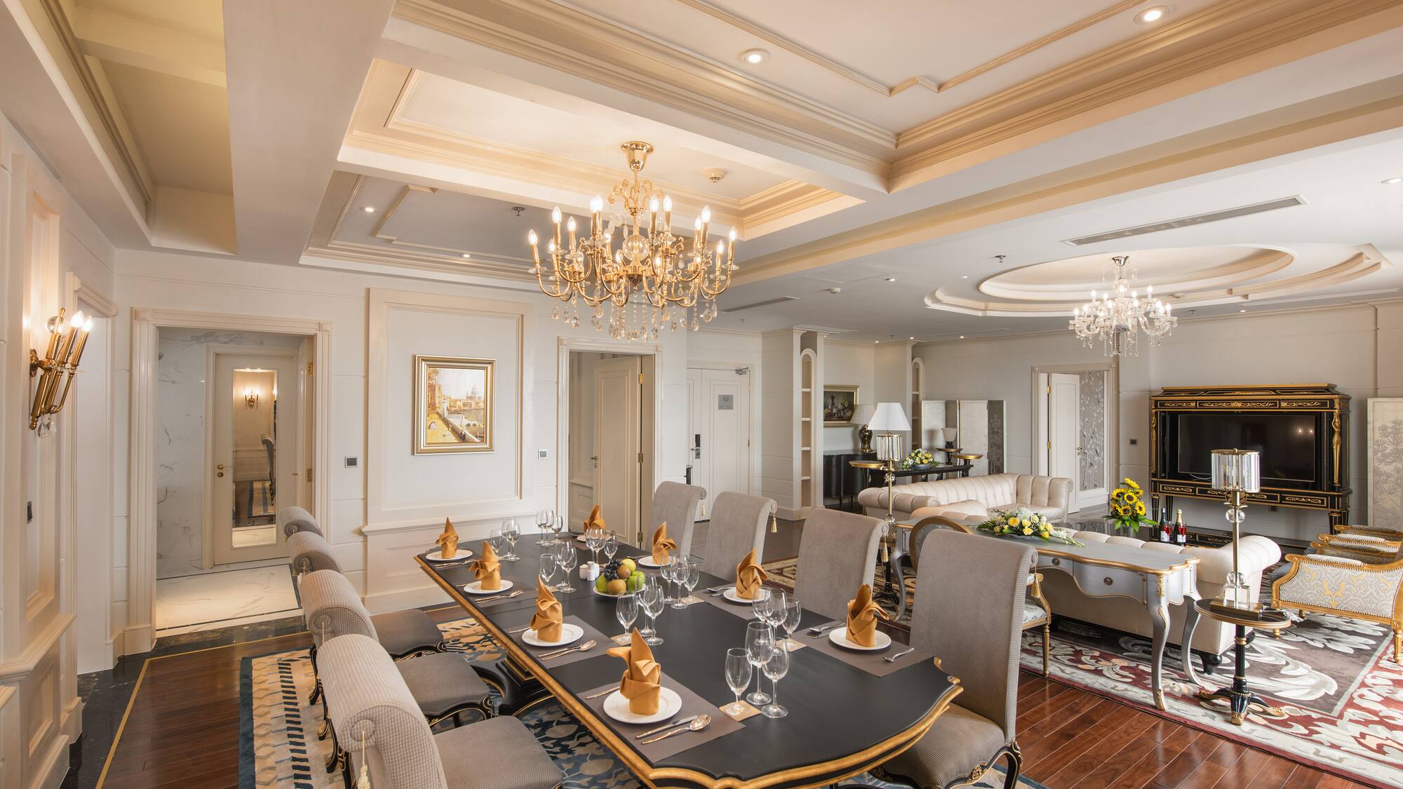 a large dining room with a chandelier and a large table