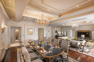 a large dining room with a chandelier and a large table