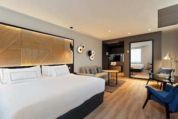 a room with a bed and a mirror