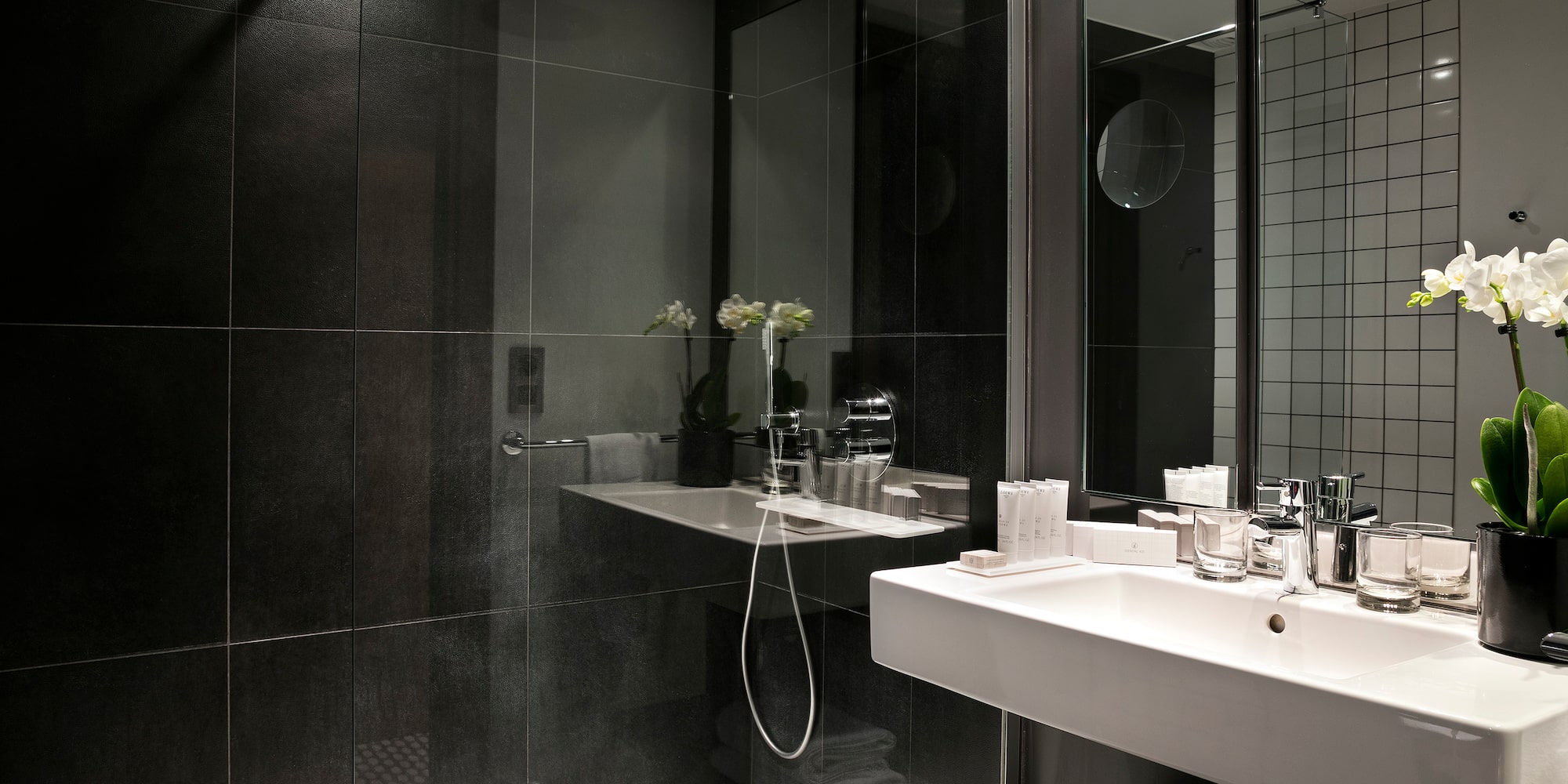 a bathroom with a shower and sink