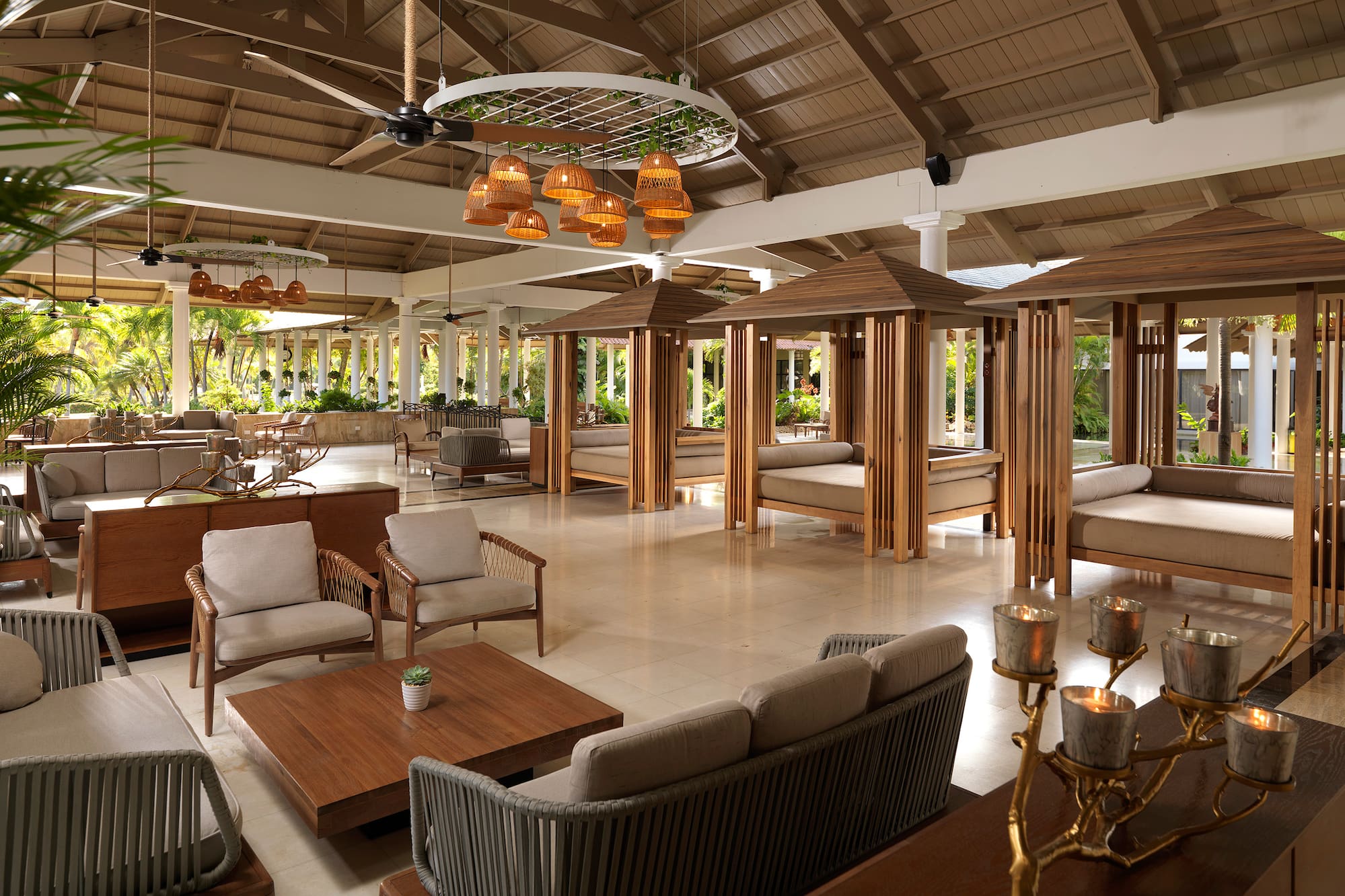 a room with a large area with furniture and tables