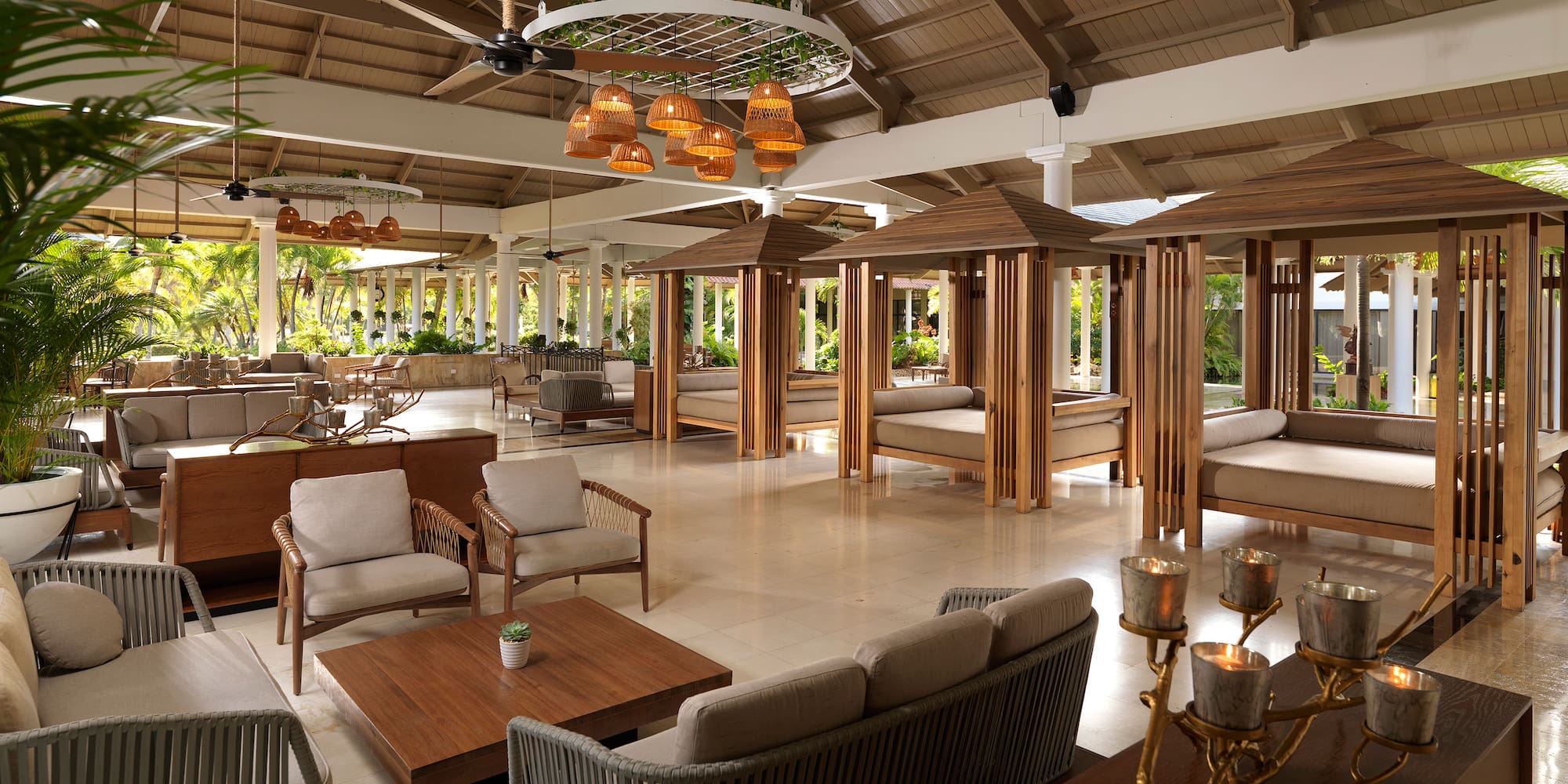 a room with a large area with furniture and tables