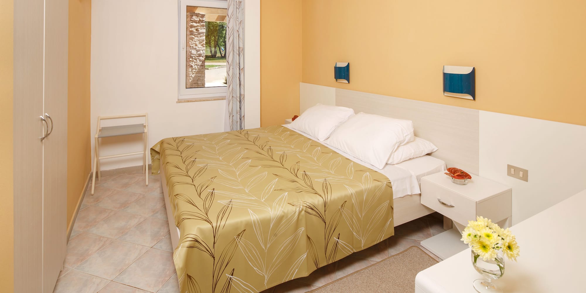 a bedroom with a bed and a table