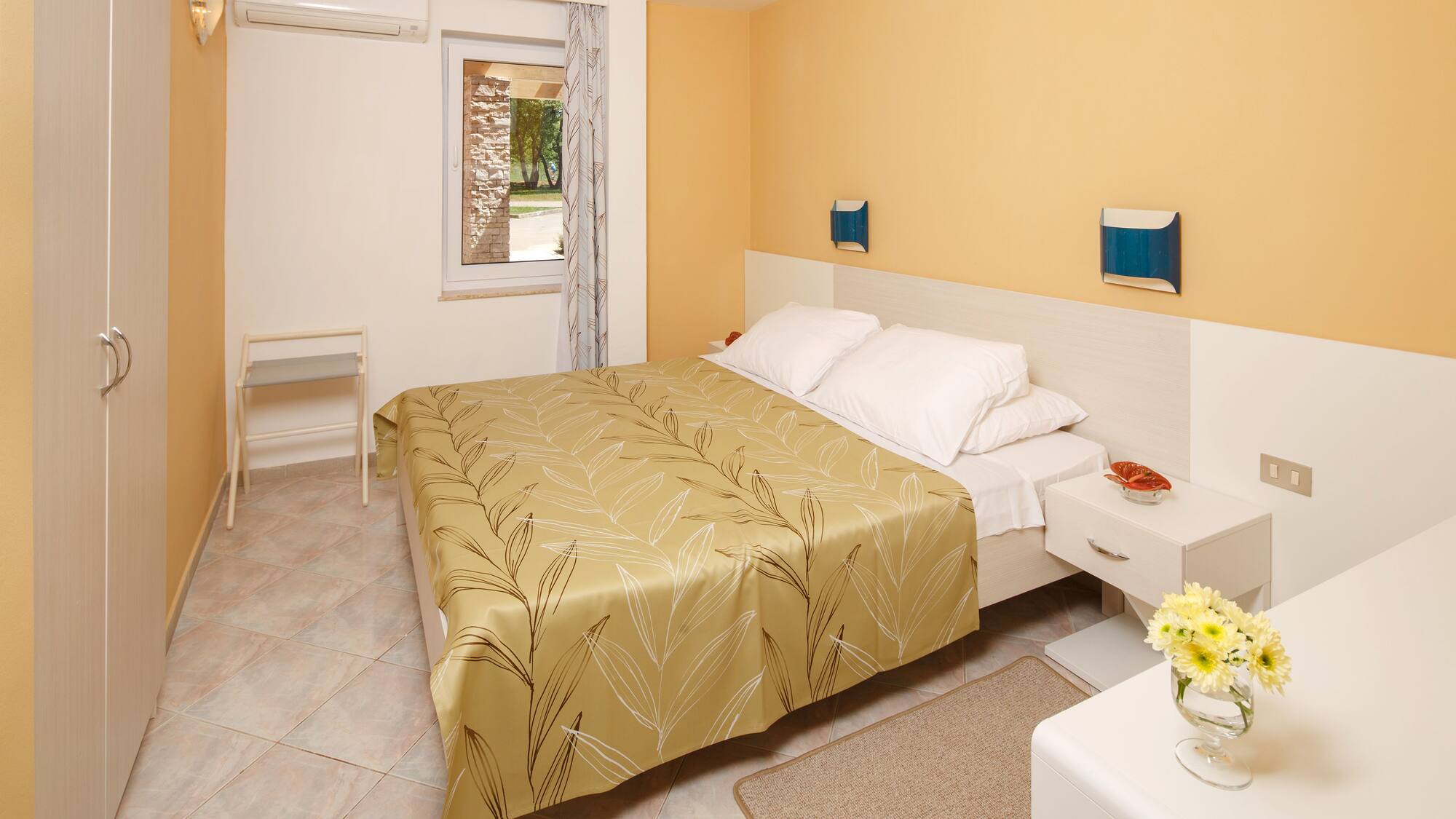 a bedroom with a bed and a table