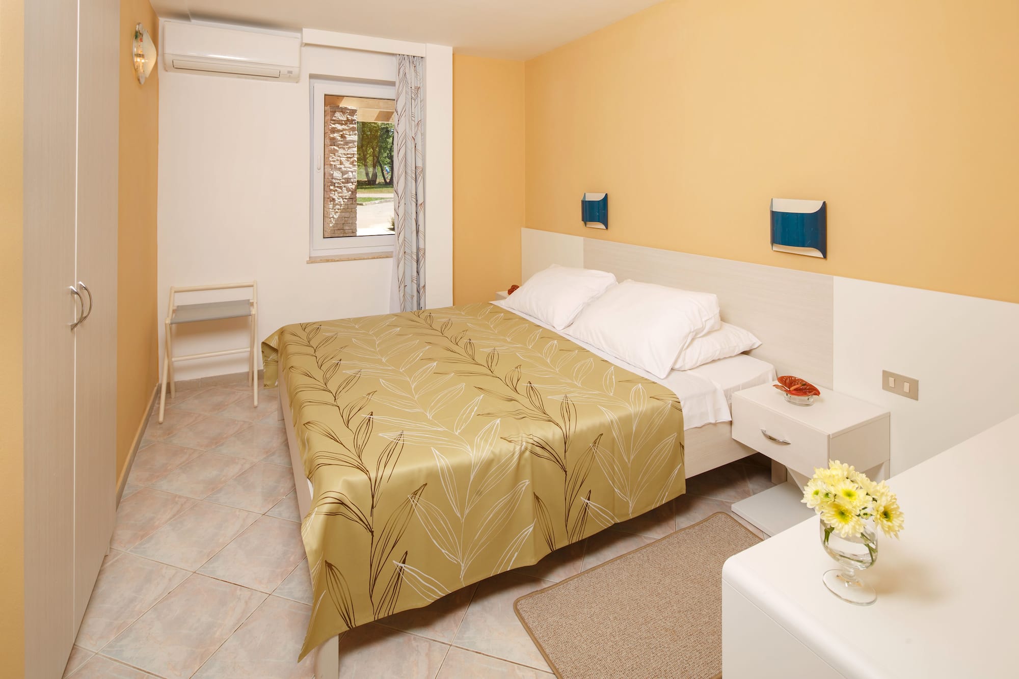 a bedroom with a bed and a table