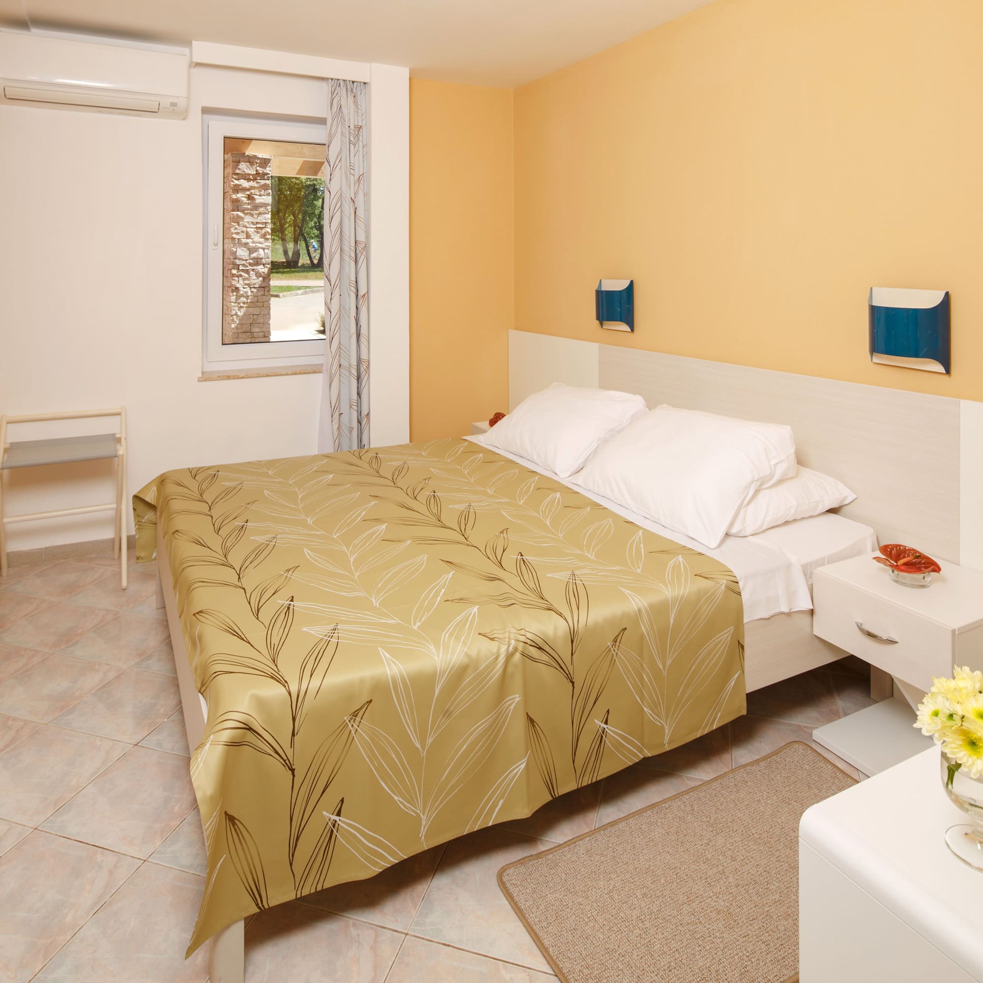 a bedroom with a bed and a table